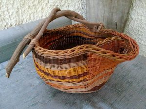 woven basket with wood handles